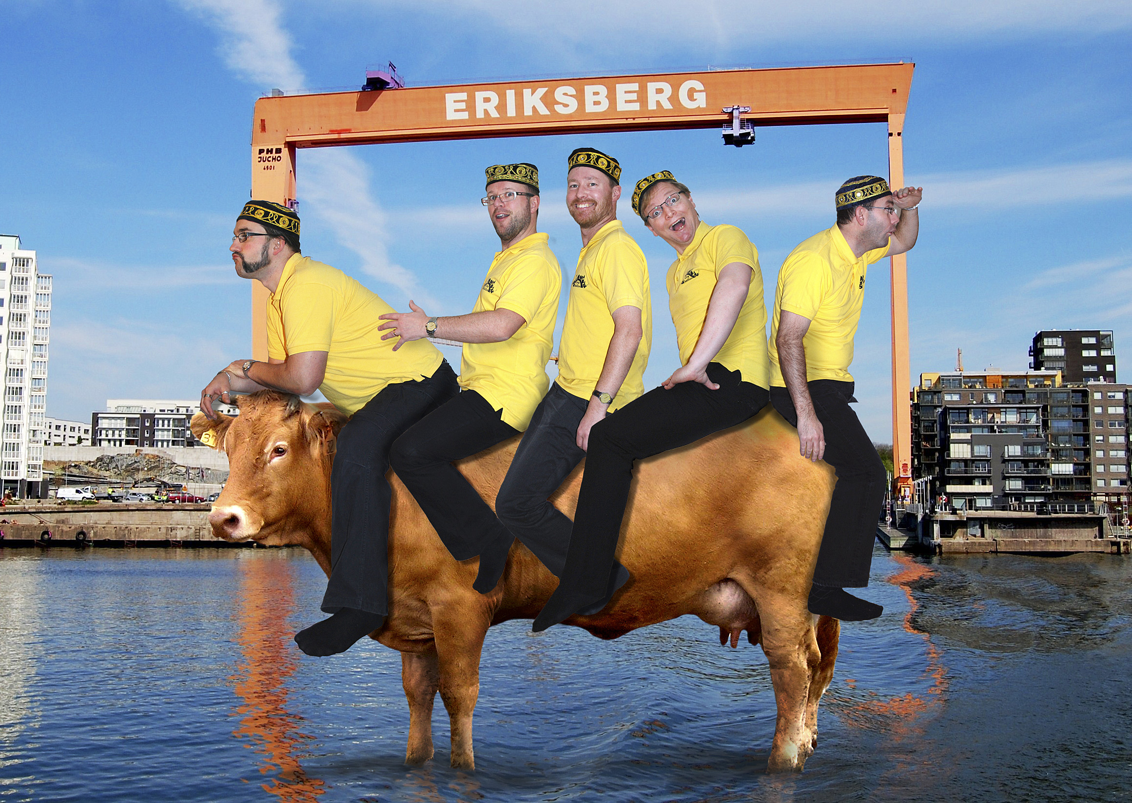 Five male coded people are sitting on a cow in front of the Eriksberg crane. They are wearing yellow polo shirts, black trousers and black kufi hats.