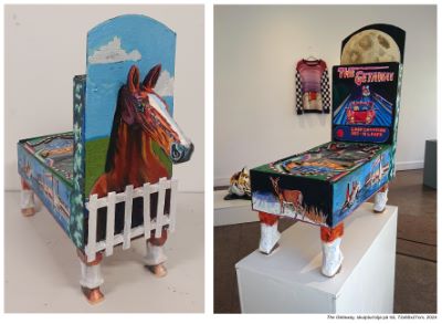 Two colorful sculptures. From one side, a painted horse is visible behind a white fence. From the other side, the piece resembles a colorful arcade game with the text