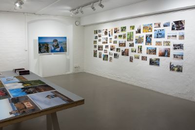 Artwork hanging on white wall.